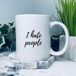 Mug that says: I hate people on it in a handwriting script style font